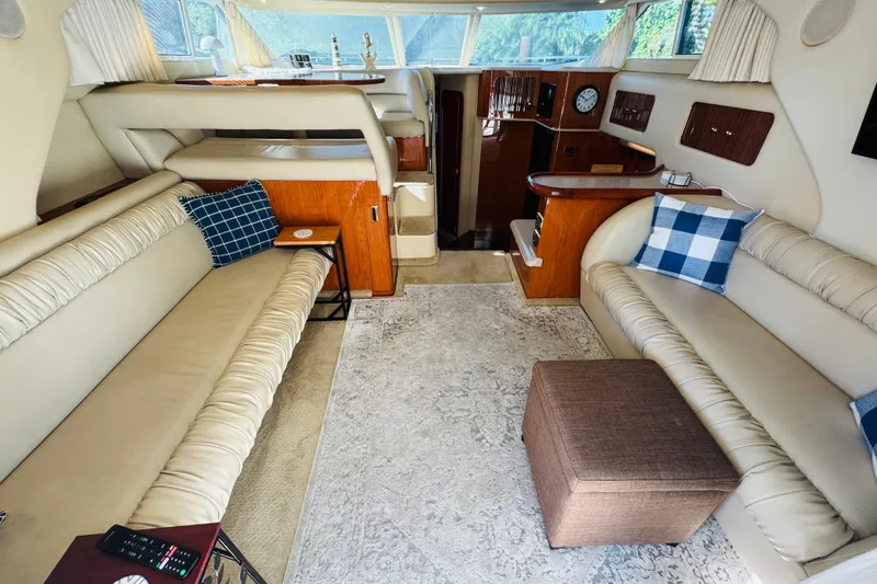Slide: The Image of Luxurious interior of a 2000 Sea Ray 400 Sedan Bridge yacht with plush seating. - 26