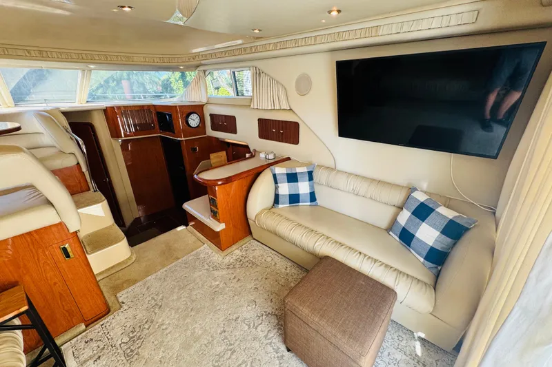 Slide: The Image of Luxurious interior of 2000 Sea Ray 400 Sedan Bridge yacht with plush seating and modern amenities. - 27