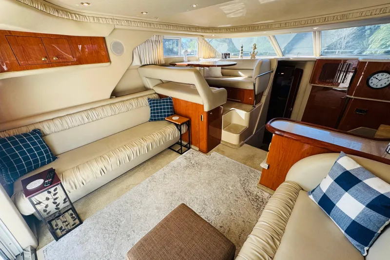 Slide: The Image of Luxurious interior of a 2000 Sea Ray 400 Sedan Bridge yacht with elegant seating. - 28