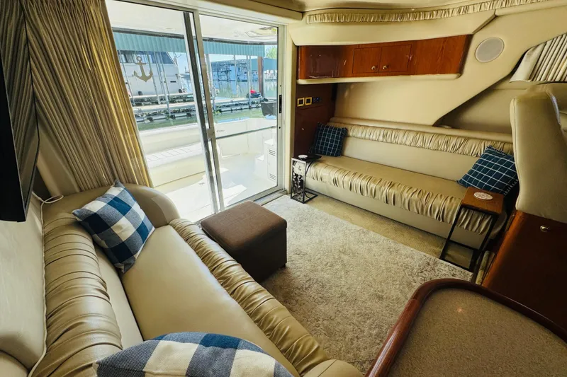 Slide: The Image of Luxurious interior of a 2000 Sea Ray 400 Sedan Bridge yacht with plush seating. - 30