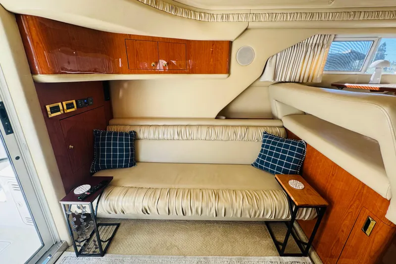 Slide: The Image of Luxurious interior of 2000 Sea Ray 400 Sedan Bridge with leather seating and wooden accents. - 32