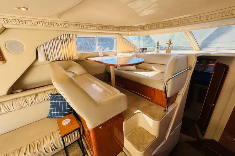 Slide: The Image of Luxurious interior of 2000 Sea Ray 400 Sedan Bridge yacht with elegant seating and decor. - 34