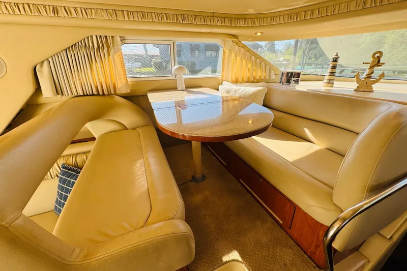 Slide: The Image of Luxurious interior of 2000 Sea Ray 400 Sedan Bridge yacht with elegant seating and decor. - 35