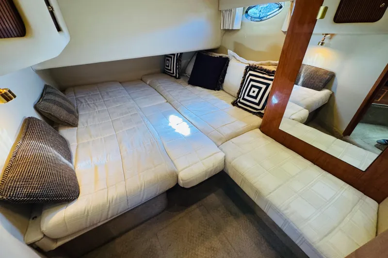 Slide: The Image of Luxurious cabin interior of 2000 Sea Ray 400 Sedan Bridge yacht with cozy bedding. - 43