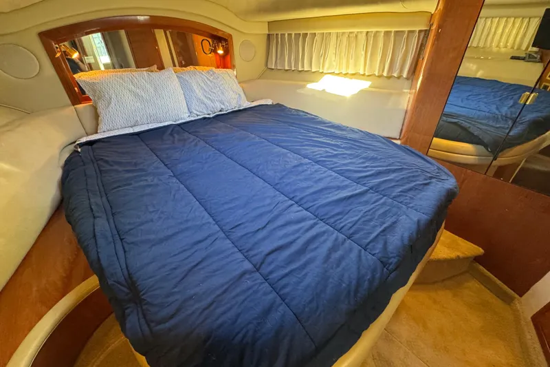 Slide: The Image of Luxurious bedroom interior of 2000 Sea Ray 400 Sedan Bridge yacht. - 47