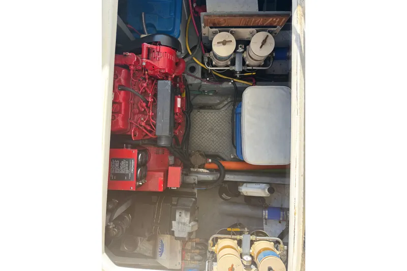 Slide: The Image of Engine compartment of a 2000 Sea Ray 400 Sedan Bridge, showcasing mechanical components. - 55