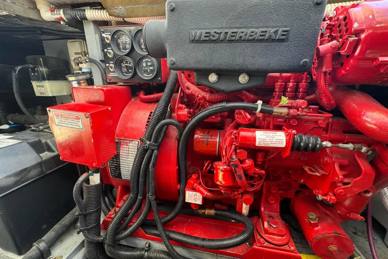 Slide: The Image of Engine compartment of a 2000 Sea Ray 400 Sedan Bridge with Westerbeke generator. - 59