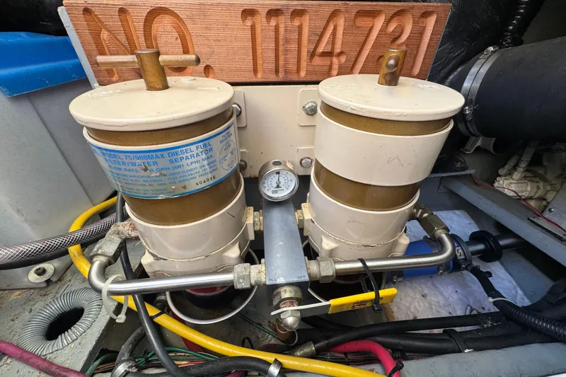 Slide: The Image of Diesel fuel filter system in a 2000 Sea Ray 400 Sedan Bridge engine room. - 62