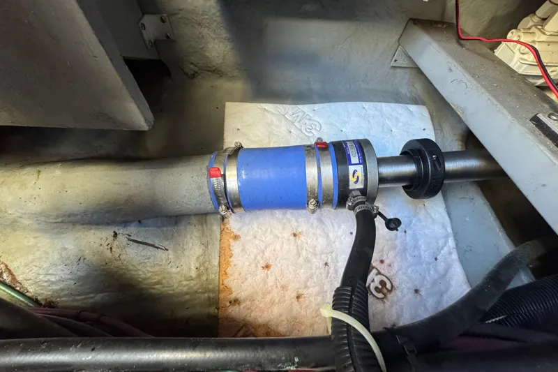 Slide: The Image of Engine room of 2000 Sea Ray 400 Sedan Bridge showing shaft and hose connections. - 63