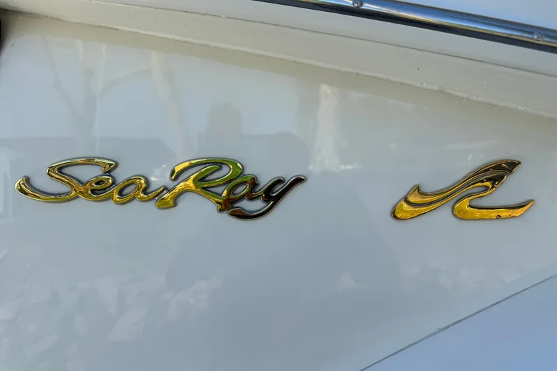 Slide: The Image of Gold "Sea Ray" logo on a 2000 Sea Ray 400 Sedan Bridge yacht. - 64