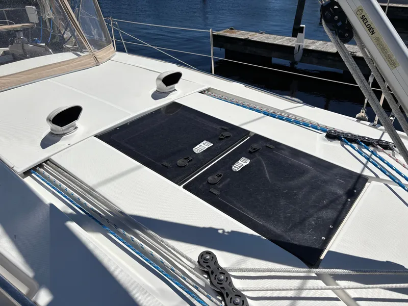 Slide: The Image of 2016 Marlow-Hunter 37 deck with hatches and ropes at dock. - 10
