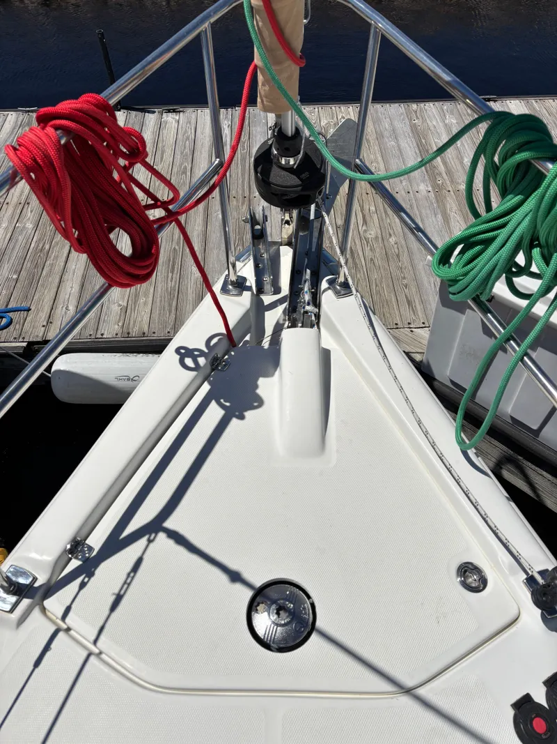 Slide: The Image of Bow of a 2016 Marlow-Hunter 37 sailboat with red and green ropes. - 13
