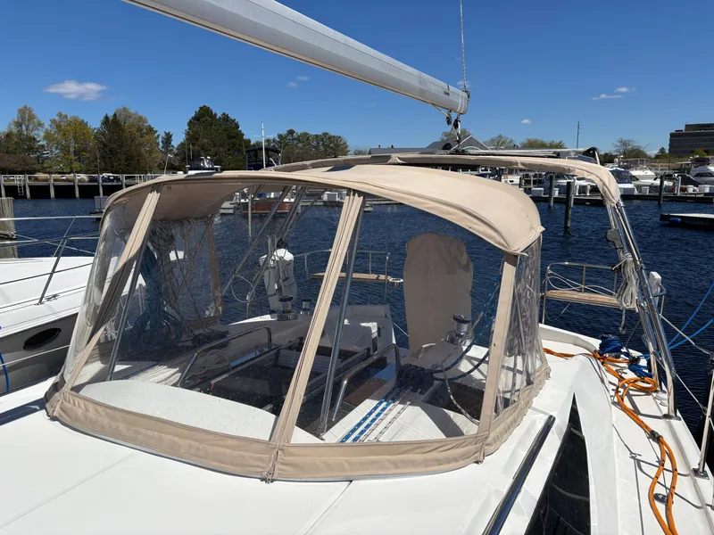 Slide: The Image of 2016 Marlow-Hunter 37 sailboat with canopy in harbor. - 23