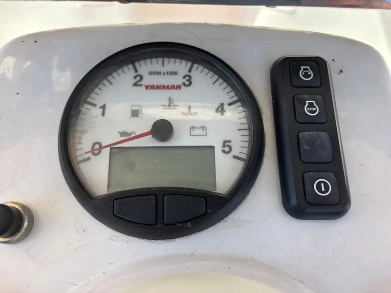 Slide: The Image of Yanmar tachometer and controls on 2016 Marlow-Hunter 37. - 32