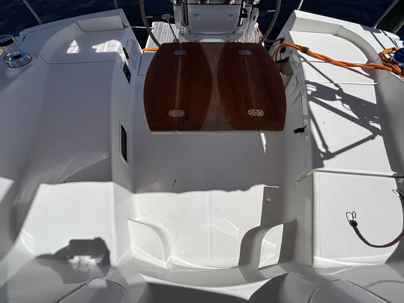 Slide: The Image of Cockpit of a 2016 Marlow-Hunter 37 sailboat with wooden table. - 36