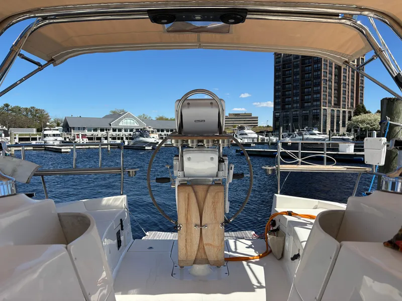 Slide: The Image of Cockpit view of a 2016 Marlow-Hunter 37 in the marina. - 39