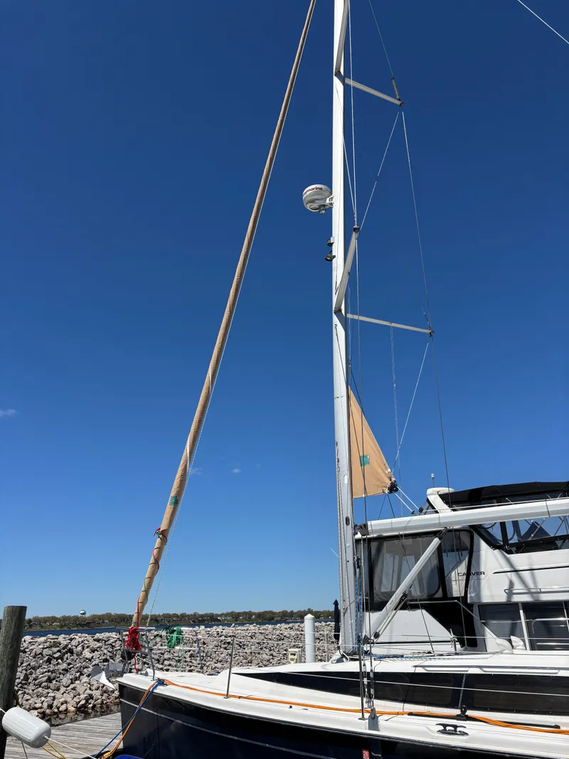 Slide: The Image of 2016 Marlow-Hunter 37 sailboat at dock, blue sky. - 4