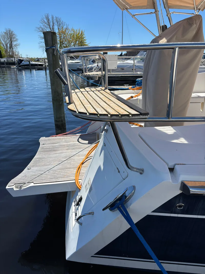 Slide: The Image of 2016 Marlow-Hunter 37 yacht at dock with wooden platform. - 44