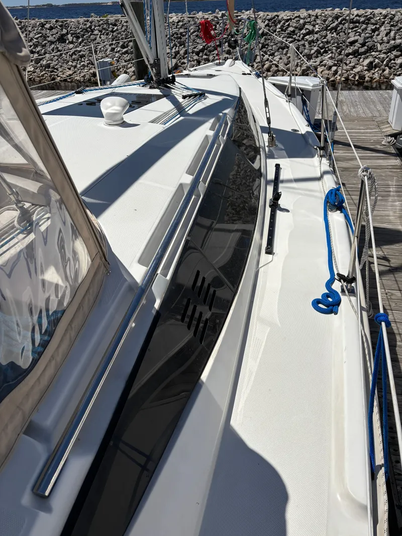 Slide: The Image of 2016 Marlow-Hunter 37 sailboat docked, side view. - 8
