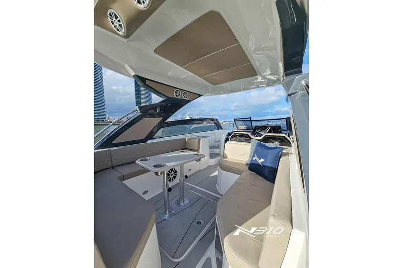 Slide: The Image of Interior of 2026 NX Boats NX310, featuring sleek seating and modern design elements. - 6