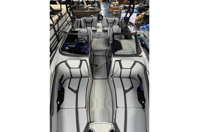Slide: The Image of 2026 Yamaha Boats 255XD interior with sleek gray seating and modern design. - 12