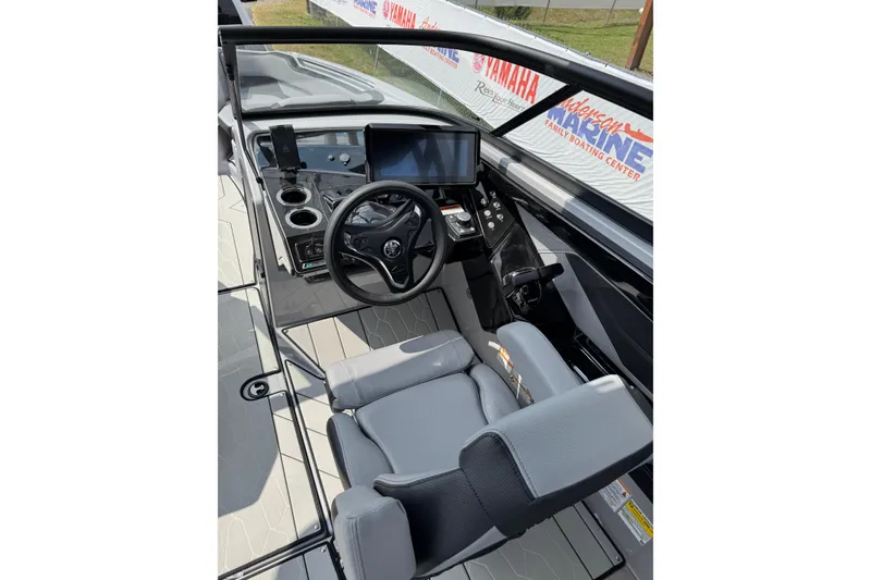 Slide: The Image of 2026 Yamaha Boats 255XD cockpit with modern steering and control panel. - 5