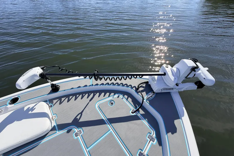 Slide: The Image of 2022 Sportsman Masters 247 Bay Boat with trolling motor on calm water. - 10