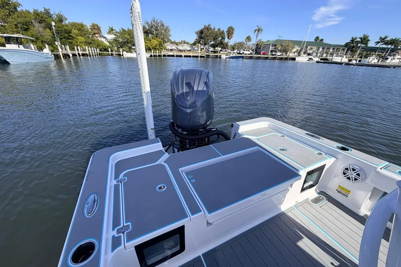 Slide: The Image of 2022 Sportsman Masters 247 Bay Boat on calm water, showcasing sleek design and modern features. - 15