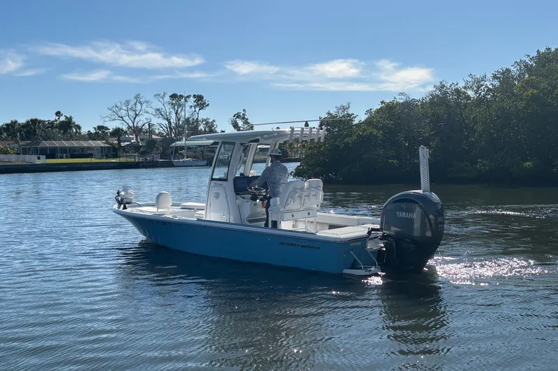 Slide: The Image of 2022 Sportsman Masters 247 Bay Boat cruising on a sunny day with Yamaha engine. - 6