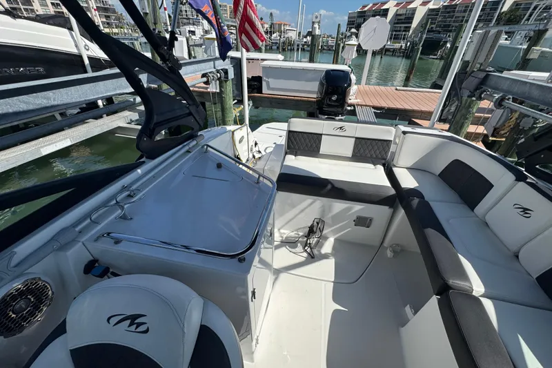 Slide: The Image of 2019 Monterey M-65 boat interior with seating, docked at marina. - 11