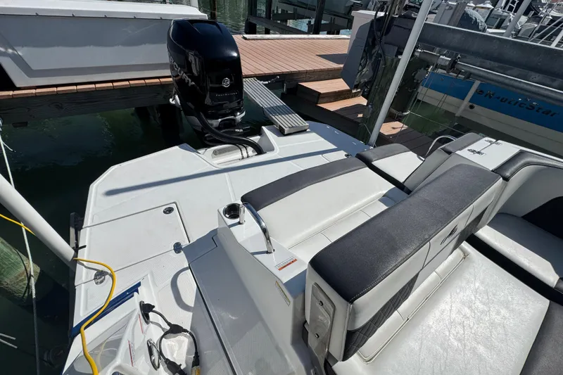 Slide: The Image of 2019 Monterey M-65 boat with outboard motor, docked at marina. - 13
