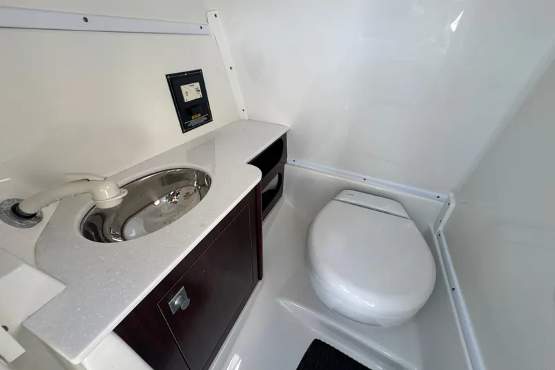 Slide: The Image of Compact bathroom in 2019 Monterey M-65 boat with sink and toilet. - 19