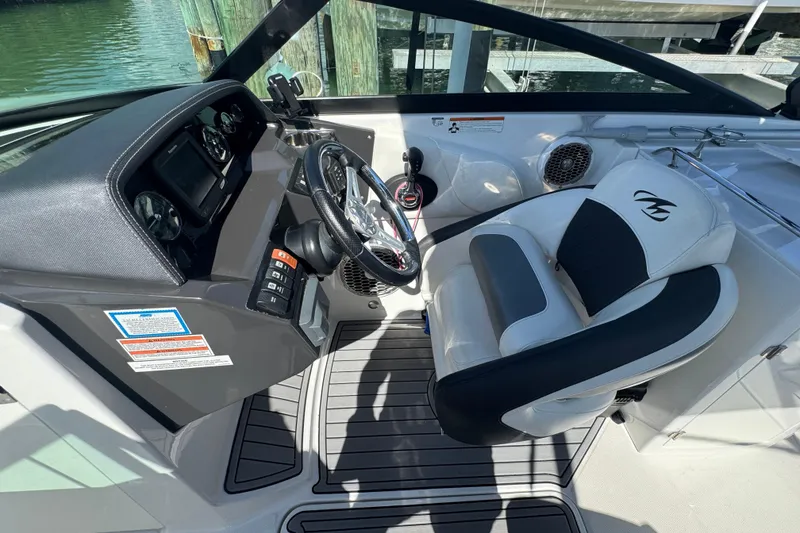 Slide: The Image of Cockpit of 2019 Monterey M-65 boat with steering wheel and control panel. - 21