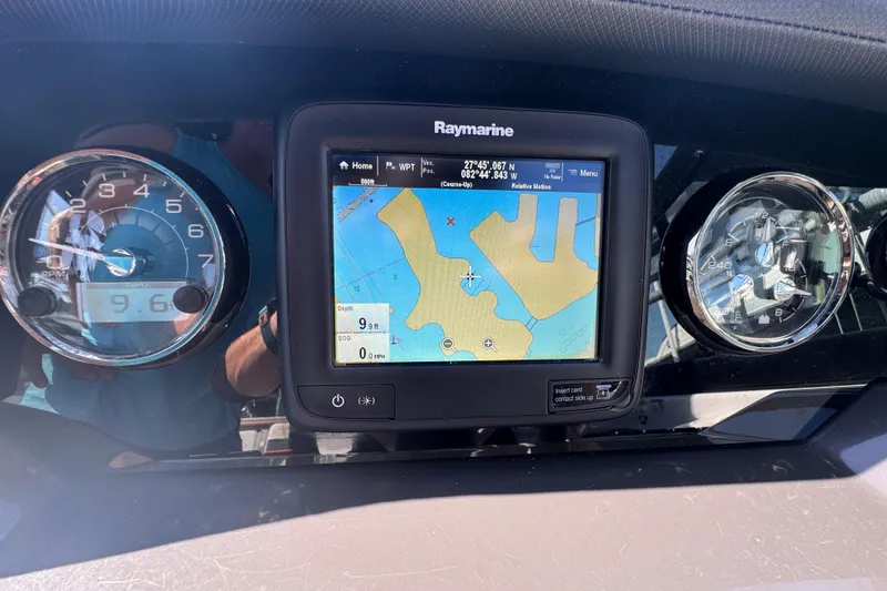 Slide: The Image of Dashboard of a 2019 Monterey M-65 boat with Raymarine navigation display. - 28