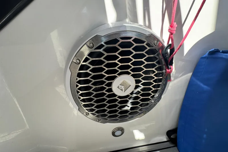 Slide: The Image of Boat speaker with hexagonal grille on a 2019 Monterey M-65, featuring red rope and blue bag. - 29