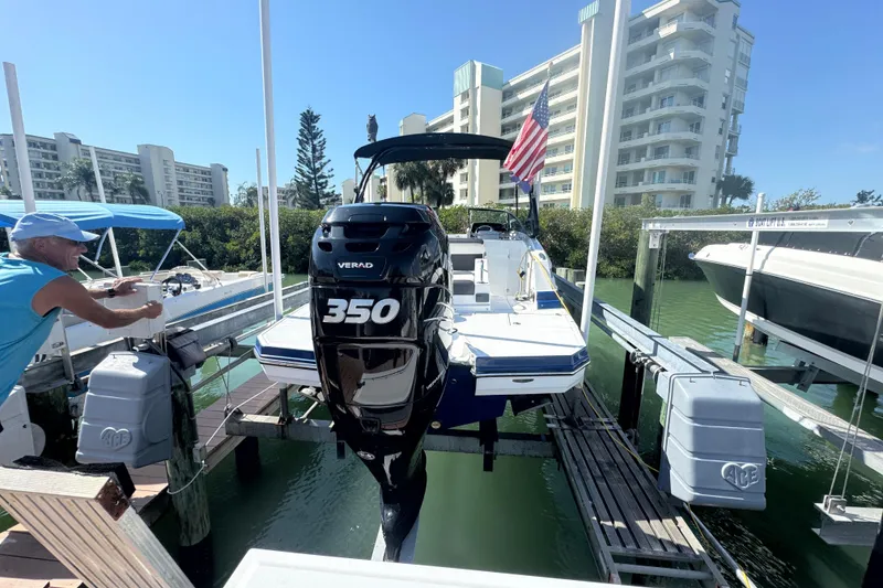 Slide: The Image of 2019 Monterey M-65 boat with Verado 350 engine docked near waterfront buildings. - 3