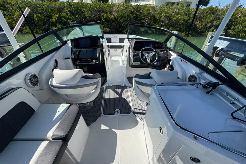 Slide: The Image of 2019 Monterey M-65 boat interior with modern seating and steering wheel. - 9