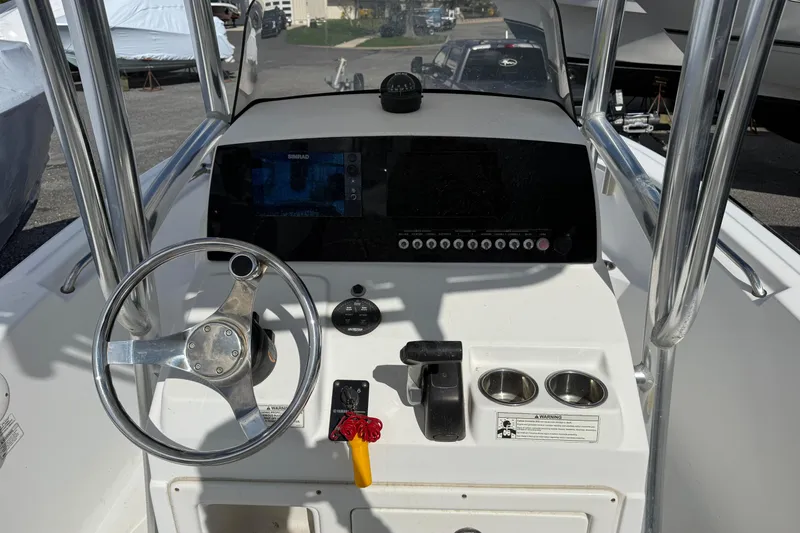 Slide: The Image of 2015 Sportsman Open 212 Center Console dashboard with steering wheel and controls. - 10