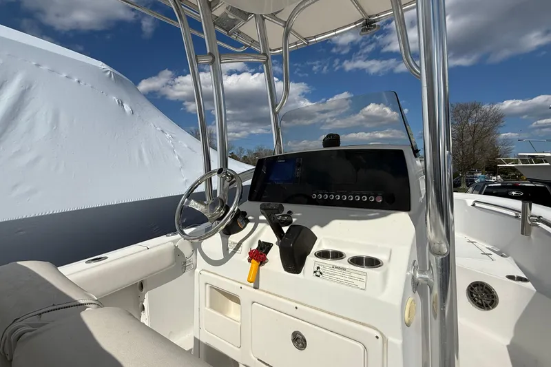 Slide: The Image of 2015 Sportsman Open 212 Center Console boat interior with steering wheel and controls. - 5