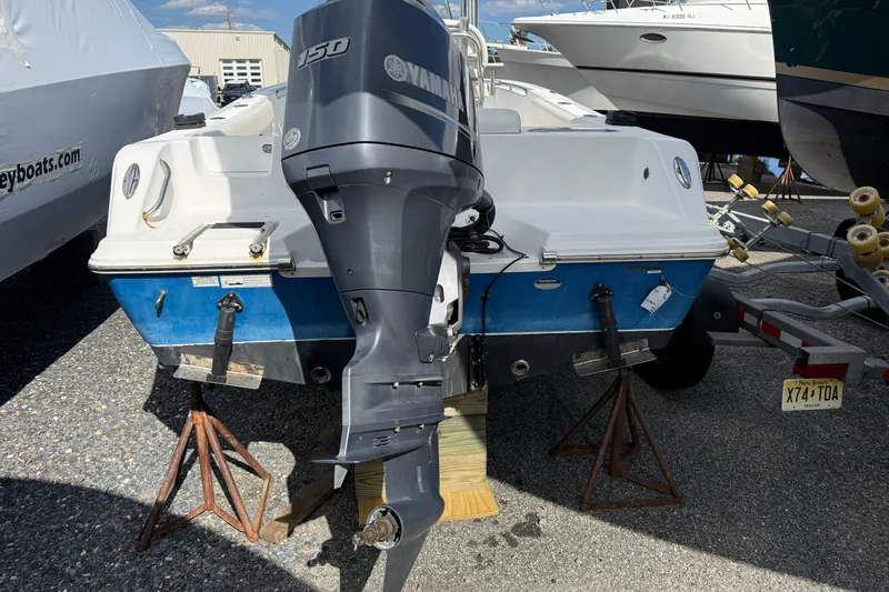 Slide: The Image of 2015 Sportsman Open 212 Center Console boat with Yamaha 150 outboard motor. - 7