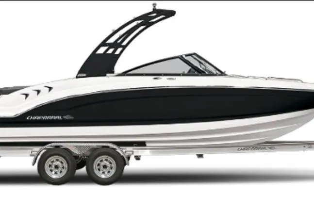 The Image of 2026 Chaparral 21 SSi OB boat on trailer, sleek black and white design. - 1