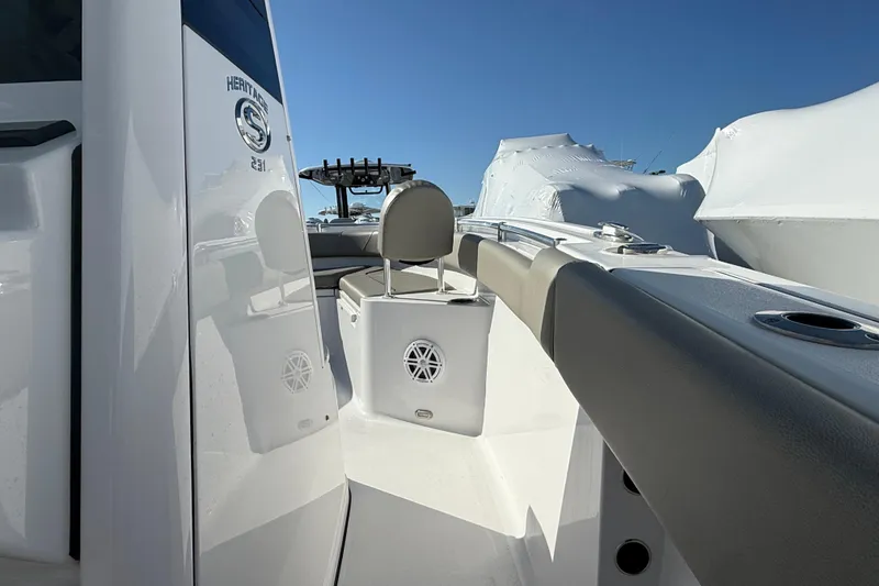 Slide: The Image of 2025 Sportsman Heritage 231 Center Console boat interior with seating and speaker detail. - 10
