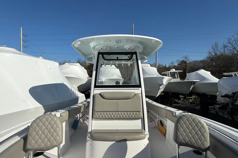 Slide: The Image of 2025 Sportsman Heritage 231 Center Console boat with sleek design and modern seating. - 7