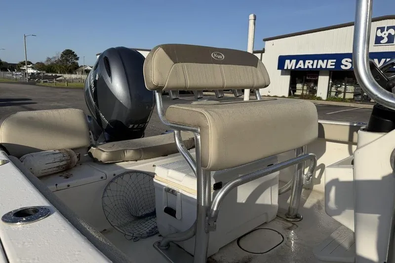Slide: The Image of 2022 Key West 189 FS boat interior with seating and Yamaha outboard motor. - 11