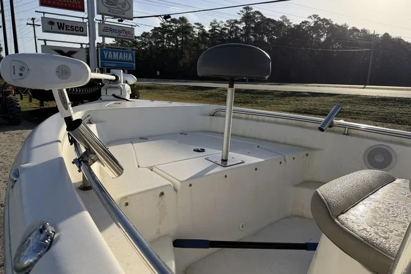 Slide: The Image of 2022 Key West 189 FS boat interior with seating and fishing rod holders. - 13