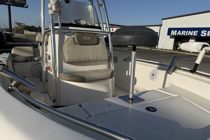 Slide: The Image of 2022 Key West 189 FS boat interior with seating and steering console. - 14