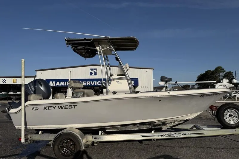 Slide: The Image of 2022 Key West 189 FS boat on trailer at marina service center. - 4