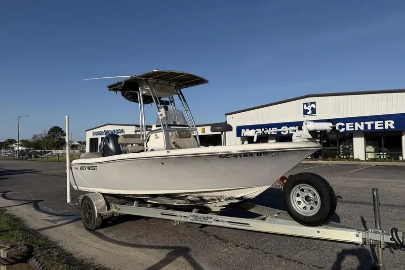 Slide: The Image of 2022 Key West 189 FS boat on trailer outside marine service center. - 5