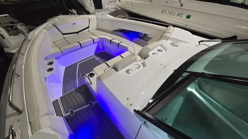 Slide: The Image of Interior of a 2017 Cruisers Yachts 338CX with blue lighting. - 11