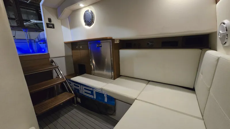 Slide: The Image of Interior of 2017 Cruisers Yachts 338CX with seating and fridge. - 19